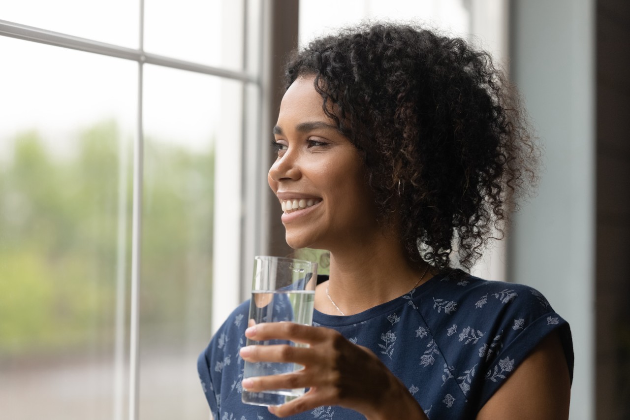 smiling-woman-drinking-water